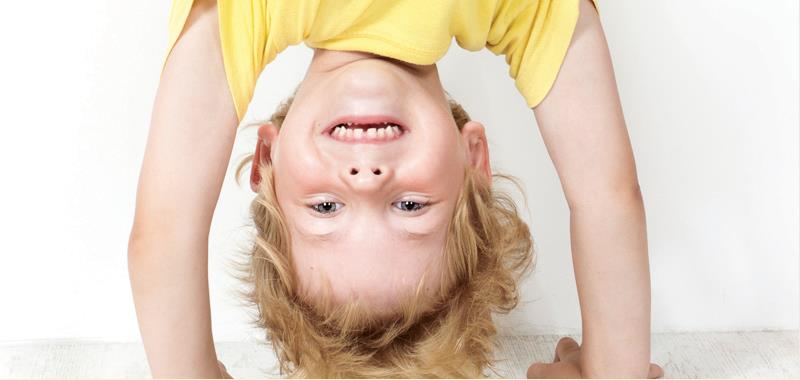 Boy in yellow shirt doing a hand stand Boy in yellow shirt doing a hand stand