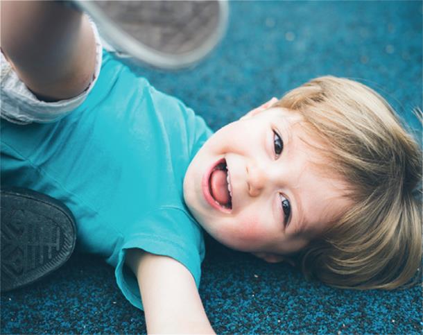 Smiling Little Boy in a Light Blue Shirt